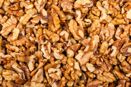 Close up shot of a pile of crushed walnutの写真素材