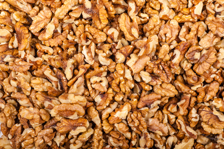 Close up shot of a pile of crushed walnutの写真素材