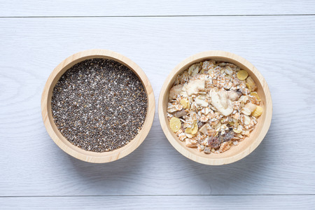 Muesli and chai seed in wooden bowlの写真素材