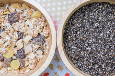 Muesli and chai seed in wooden bowlの写真素材