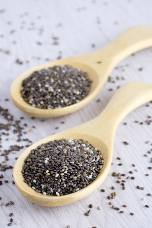 Chia seeds in wooden spoon and have another one blurの写真素材