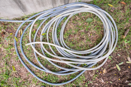 rubber tube heap on grassの写真素材
