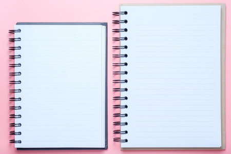 Notebook on pink background.の写真素材