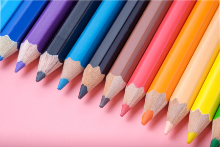 Colored pencils on pink background.の写真素材