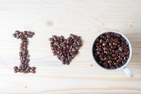 word I LOVE Coffee made by coffee beans and cup of beansの写真素材