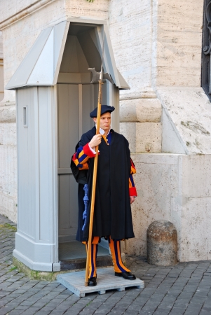 VATICAN - MARCH 10: Famous Swiss Guard on MARCH 10, 2011 in Vatican. The Papal Guard standing at the gate of Vatican Museum.のeditorial素材