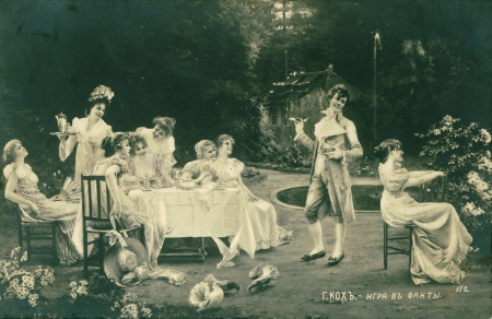 RUSSIA - CIRCA 1907: Vintage postcard depicts a people in the outdoor game, circa 1907, Russia. The company of a young people plays at forfeitsのeditorial素材