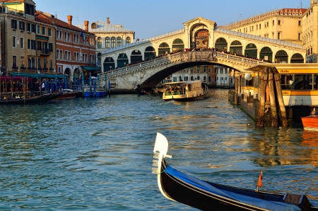 VENICE - MAR 6  Rialto Bridge  Ponte Di Rialto  in the evening with tourists on March 6, 2011 in Venice  It is oldest and one of the four bridges spanning the Grand Canal in Venice のeditorial素材
