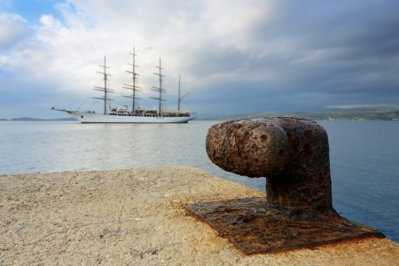 Old mooring bollard in port of Pylos, Messenia, Greeceの写真素材