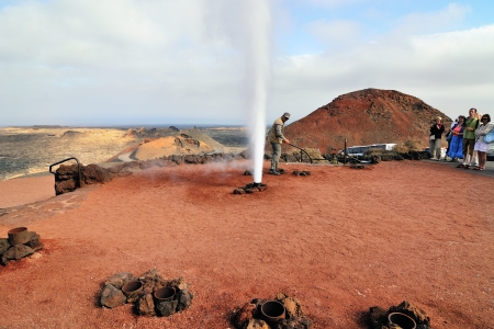 LANZAROTE SPAIN, TIMANFAYA - JUN 14 2008  Tourists on the geyser of steam show in the Timanfaya  It is the main attraction of Timanfaya national park  のeditorial素材