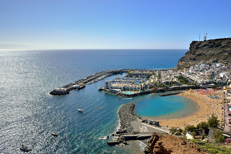 PUERTO DE MOGAN, SPAIN - FEB 19, 2014  View from above on Puerto de  Mogan, Gran Canaria  It is preferable resort of island with public beach, shopping facilities and restaurants The most popular tourist destination all the year のeditorial素材