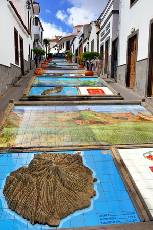 FIRGAS - FEB 26 2014  The Paseo de Canarias with representations of the 7 Canary Islands carved into the ground  with their heraldic shields and a landscape typical of each island, Firgas Gran Canariaのeditorial素材
