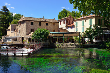 PROVENCE, FRANCE - JUL 8, 2014  Medieval Village Fontaine de Vaucluse on the river shore  The poet Petrarch made it his preferred residence in the 14th centuryのeditorial素材