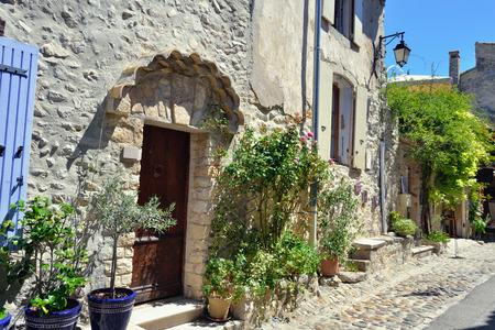 France, Provence  Typical street with medieval houses surrounded a green plant  Vaison la Romaineのeditorial素材