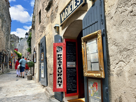 LES BAUX, FRANCE - JUL 9, 2014: Narrow street in village of  les Baux. Les Baux is now given over entirely to the tourist trade, relying on a reputation as one of the most picturesque villages in Franceのeditorial素材