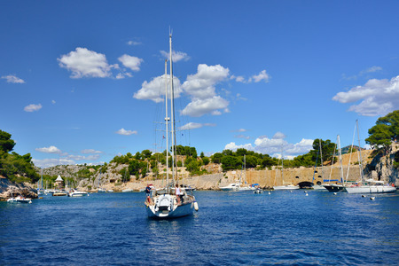 CASSIS, FRANCE - JULY 14, 2014: Yaht moored in Calanques, Cassis.  In 2012 most of Calanques were declared as tenth national park of France.Yaht moored in Calanques, Cassis.  In 2012 most of Calanques were declared as tenth national park of France.のeditorial素材