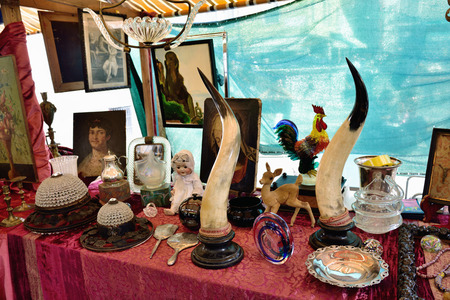 VENICE, ITALY - SEP 21, 2014: Old jewelry, accessories, toys, painting, arts, etc for sale at Venice flea market. This flea market serves the professional antique dealers.のeditorial素材