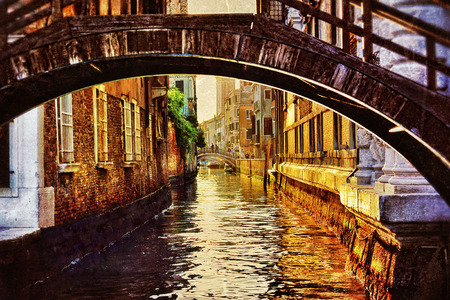 Venice canal and bridge at sunset. Tourists from all the world enjoy the historical city of Venezia in Italy      の写真素材