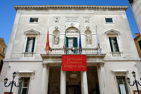 VENICE, ITALY - SEP 25, 2014: Poster of opera La Traviata on facade the theater in Venice, famous  opera house - Teatro La Fenice di Venezia. Founded in 1774  La Fenice became the site of many famous operatic premieresのeditorial素材