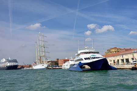 VENICE, ITALY - SEPT 21, 2014: The cruise ships moored in the Venetian port at morning. More than 10...