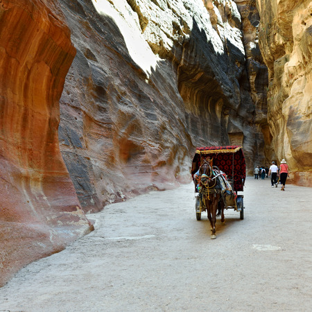 A horse carriage in a gorge, Siq canyon in Petra, Jordan. Petra is one of the New Seven Wonders of the World.のeditorial素材
