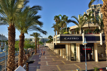 EILAT, ISRAEL - MARCH 31, 2015: Tourist walking on central street in Eilat at sunset time, famous...
