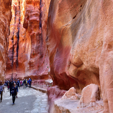 PETRA, JORDAN - APR 2, 2015: Tourists walking in Siq canyon in Petra. Petraのeditorial素材