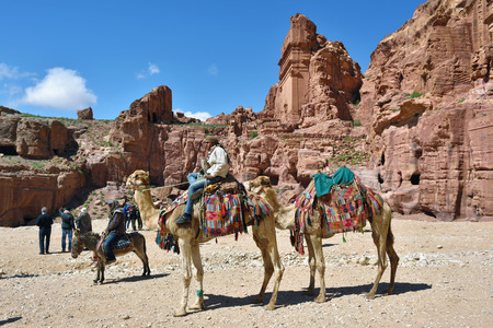 PETRA, JORDAN - APR 2, 2015: Nabataeans capital city. Unidentified local man on a camel waiting tourist. Petraのeditorial素材