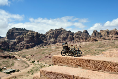 Souvenirs to sale in Petra Jordan. Toy carriage on the steps of the old templeの写真素材