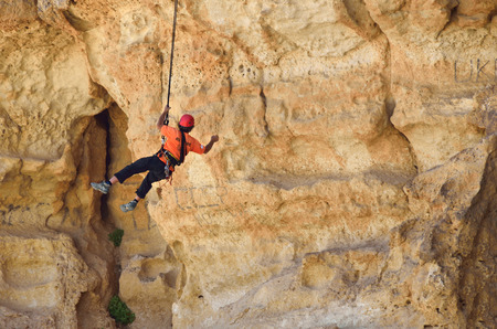 NEGEV DESERT ISRAEL MAR 23 2015: Exercise rescue units. Training rescue people in inaccessible terrain at the cliff in Negev desert. Recovery using rope techniquesのeditorial素材