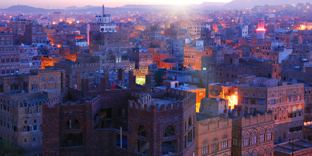 Yemen. Sunrise in the old city of Sanaa. Inhabited for more than 2.500 years at an altitude of 2.200 m, the Old City of Sanaa is a UNESCO World Heritage City now destroyed by the civil warのeditorial素材