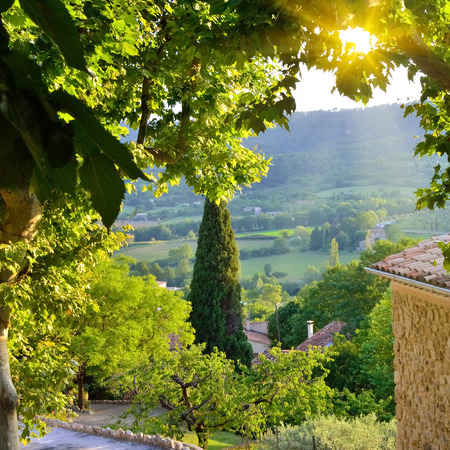 View from  medieval village of Moustiers Sainte Marie on rural landscape at sunset. Provence, Franceの写真素材