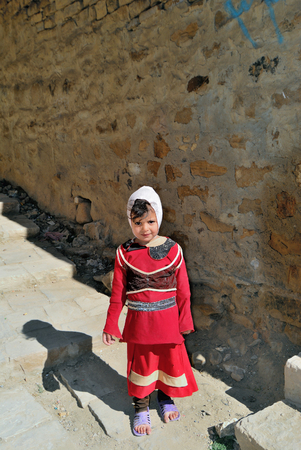 YEMEN, THULA - MAR 6, 2010: Unidentified Yemeni girl on the street in Thula. Children grow up in the poorest country with little opportunity for educationのeditorial素材