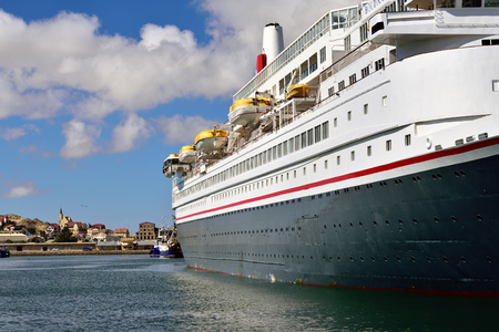 LUDERITZ, NAMIBIA - JAN 27, 2016: Big cruise ship shown in the port of Luderitz in the early morning. Luderitz is popular destination a many of cruise linesのeditorial素材