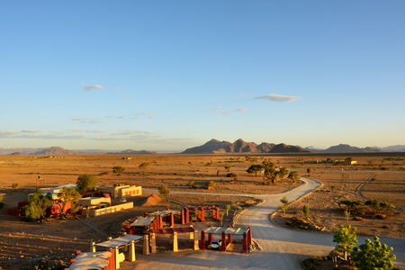 SOSSUSVLEI, NAMIBIA - JAN 30, 2016: Entrance in the Sossusvlei Lodge. View from above at sunset. The most popular place in Namib-Naukluft park.のeditorial素材