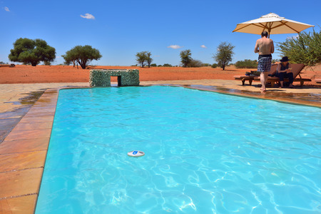 KALAHARI, NAMIBIA - JAN 23, 2016: Swimming pool in Bagatelle Kalahari Game Ranch, one from the most famous and popular place in Kalahari desert to stay and relax during safariのeditorial素材