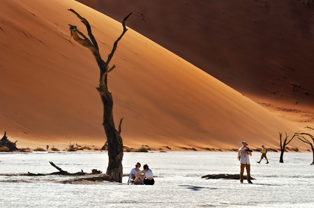 DEADVLEI, NAMIBIA - JAN 29, 2016: Tourists visit the Deadvlei, Sossusvlei. Namib-Naukluft National Park, Namibia, Africaのeditorial素材