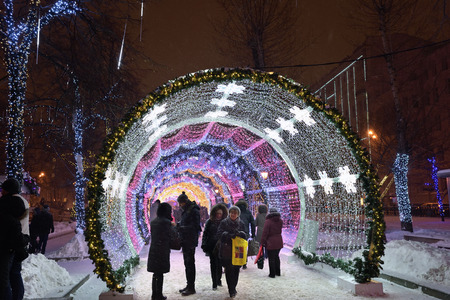 MOSCOW, RUSSIA - JAN 16, 2016: Moscow winter street scene. People walking along the Tverskoy bulvar during annual festival Christmas lightのeditorial素材