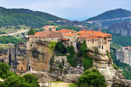 Meteora monasteries. Beautiful view on the Holy Monastery of Varlaam placed on the edge of high rock...