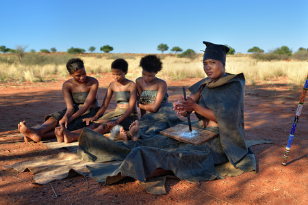 KALAHARI, NAMIBIA - JAN 24, 2016: Women in bushmen tribe village. The San people, also known as Bushmen are members of various indigenous hunter-gatherer peoples of Southern Africaのeditorial素材