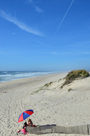 Costa Nova, Portugal - June 09, 2017: Atlantic Ocean, Costa Nova beach in Aveiro. People relaxe on the  very popular place to spend weekends and vacation timeのeditorial素材