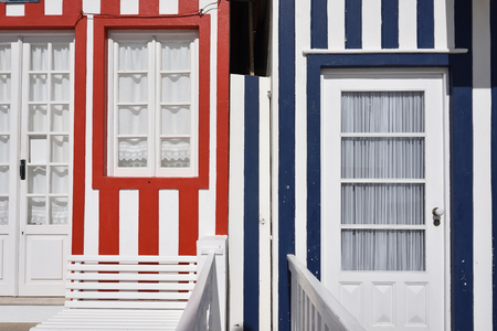 Detail of the houses in famous resort Costa Nova on the Atlantic coast in Beira Litoral, Portugal. Popular tourist destination to spend vacation timeの写真素材