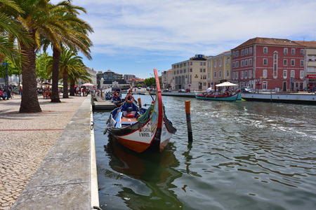 AVEIRO, PORTUGAL - JUNE 10, 2017: Traditional boats moliceiro on main city canal. Aveiro, known as Venice of Portugal, also known for its production of salt, which is used for fertilizer in the areaのeditorial素材