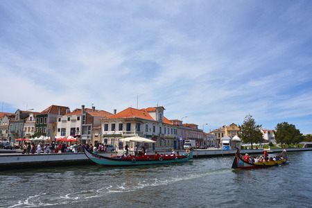 AVEIRO, PORTUGAL - JUNE 10, 2017: Traditional boats moliceiro on main city canal. Aveiro, known as Venice of Portugal, also known for its production of salt, which is used for fertilizer in the areaのeditorial素材