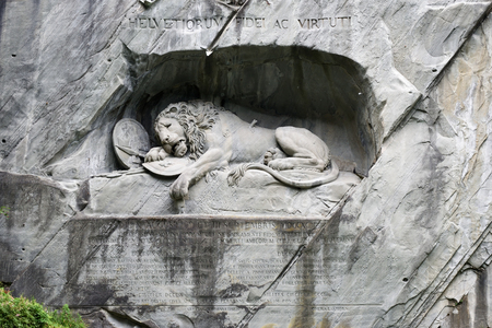 The Lion of Lucerne. The monument of Dying Lion was carved in rock wall by the design of Danish artist Thorwaldsen. It is a World famous tourist attractions. Lucerne, Switzerlandの写真素材