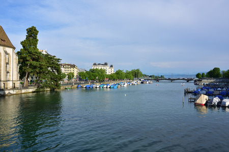 Zurich, Switzerland - June 14, 2017: The Limmat river and the Limmatquai quay, Zurich lake in the background. Zurich is the largest city in Switzerland and the capital of the canton of Zurichのeditorial素材
