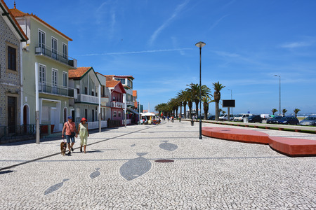 Costa Nova, Portugal - June 09, 2017: Senior couple with a walk on the street in the famous resort of Beira Litoral, Portugal.のeditorial素材