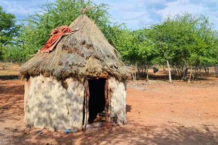 Traditional african hut in himba tribe village, Namibiaの写真素材