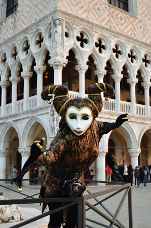 Venice, Italy - March 7, 2011: An unidentified masked person in costume in St. Mark's Square during the Carnival of Venice. The 2011 carnival was held from February 26th to March 8thのeditorial素材
