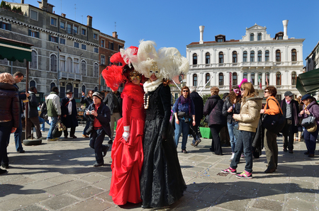 Venice, Italy - March 6, 2011: Two unidentified masked persons in costume on S. Maria Formosa Square during the Carnival of Venice. The 2011 carnival was held from February 26th to March 8thのeditorial素材